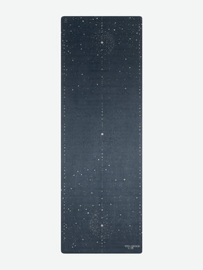 Navy blue yoga mat with cosmic pattern from Yoga Design Lab, non-slip surface, eco-friendly material, front view.